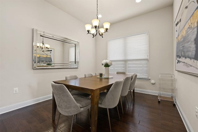 dining room featuring an inviting chandelier and dark hardwood / wood-style flooring