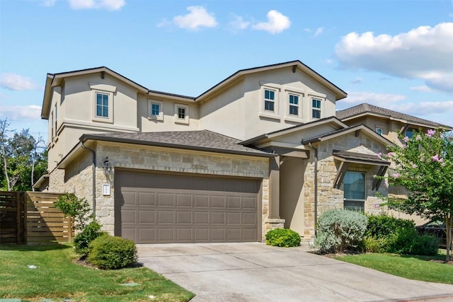 view of front facade with a garage and a front yard