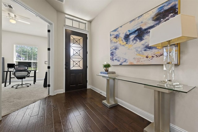 foyer featuring dark wood-type flooring and ceiling fan