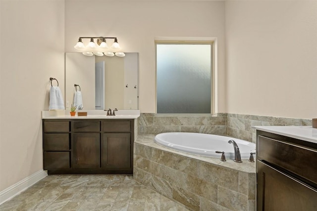 bathroom with vanity and tiled bath