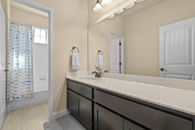 bathroom featuring shower / bath combination with curtain, tile patterned floors, and vanity