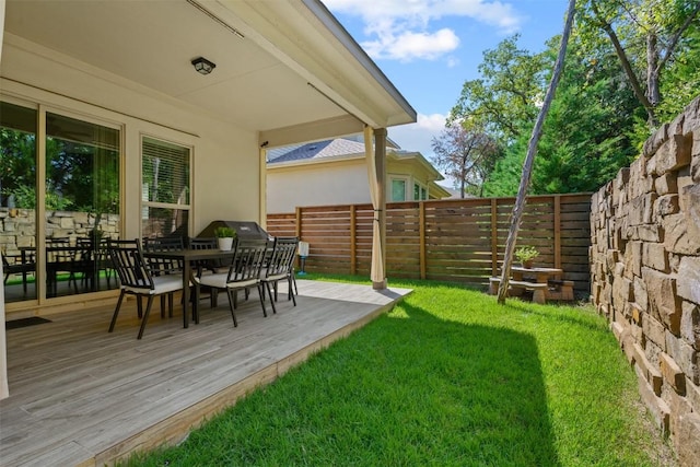 view of yard with a wooden deck