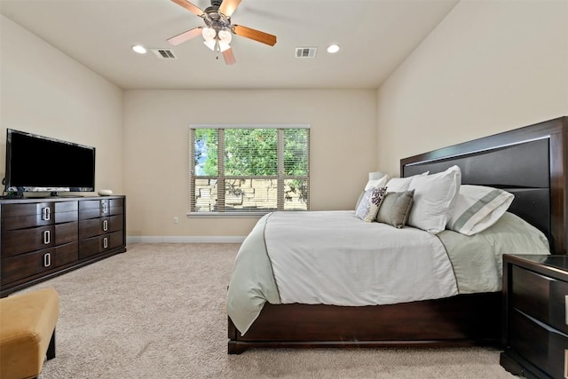 bedroom with light carpet and ceiling fan