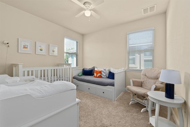 carpeted bedroom featuring ceiling fan