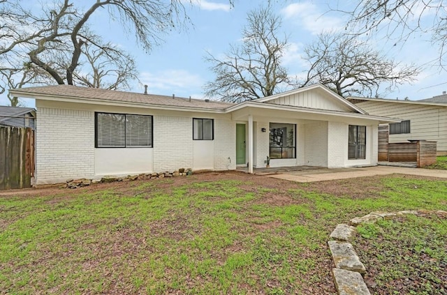 single story home featuring a patio and a front lawn