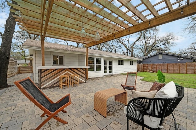 view of patio / terrace featuring a bar, an outdoor hangout area, a pergola, and french doors