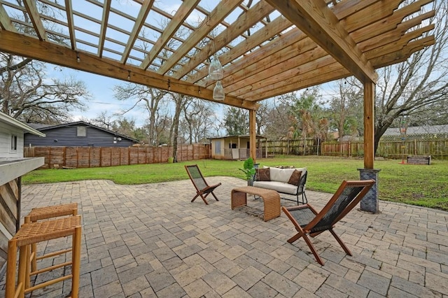 view of patio / terrace featuring an outdoor structure and a pergola