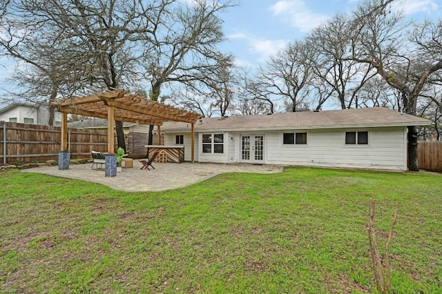 back of house featuring a pergola, a yard, a patio area, and french doors