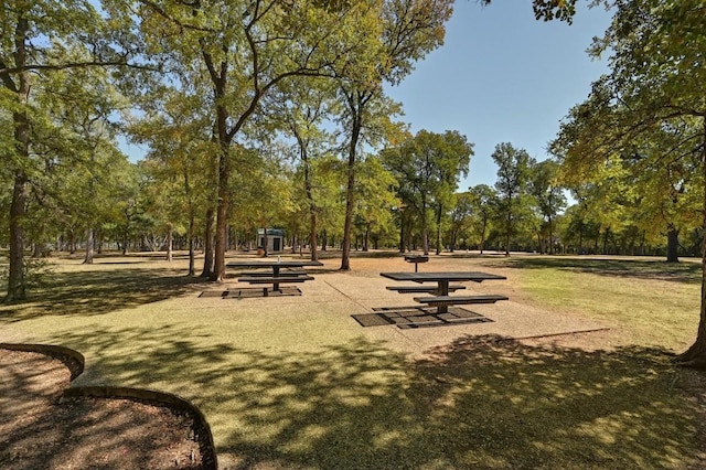 view of property's community with a lawn