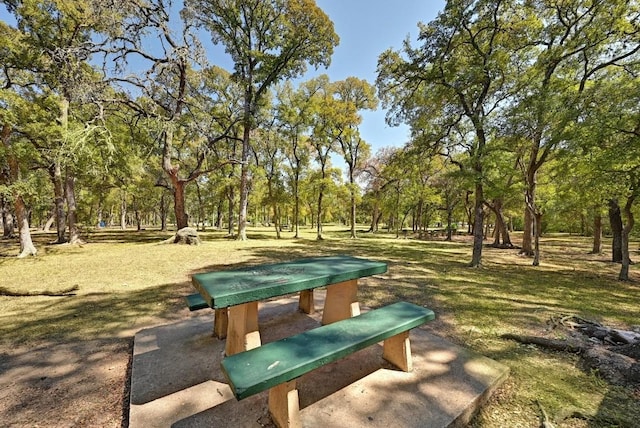 view of home's community with a lawn