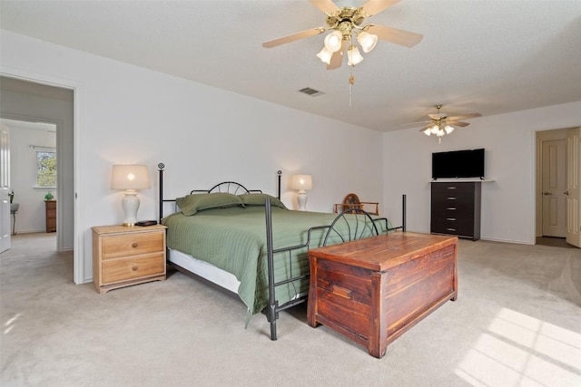 bedroom featuring ceiling fan and light colored carpet