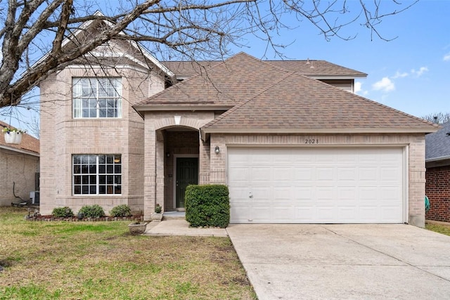 front of property with a garage and a front yard