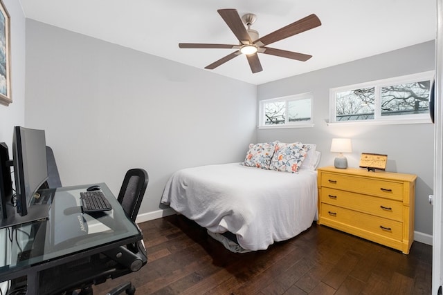 bedroom with ceiling fan and dark hardwood / wood-style floors