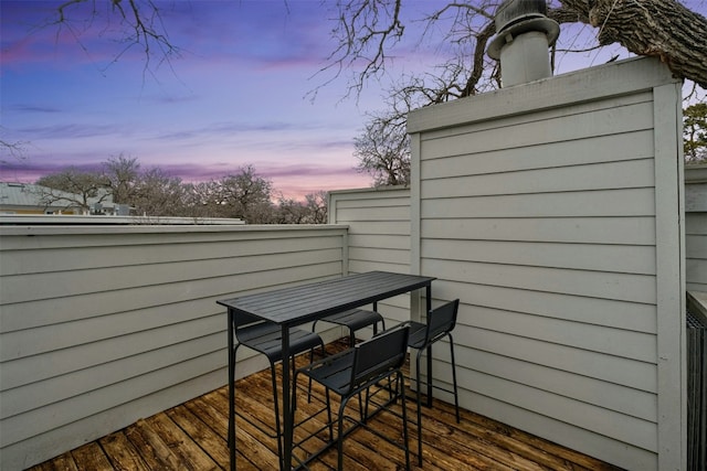 view of balcony at dusk