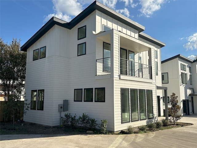 view of property exterior with a balcony