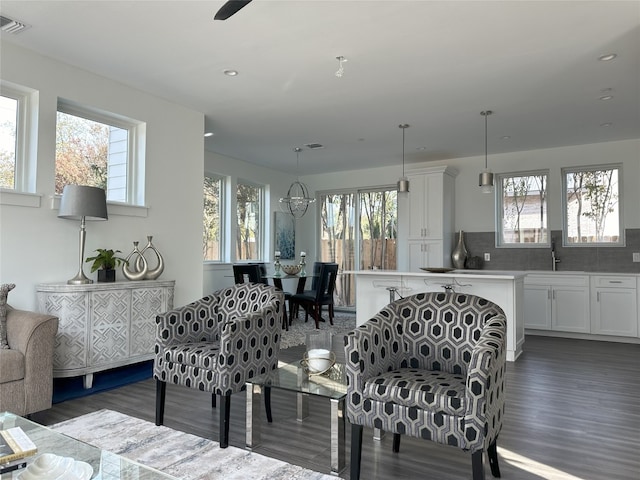 living room with dark hardwood / wood-style flooring