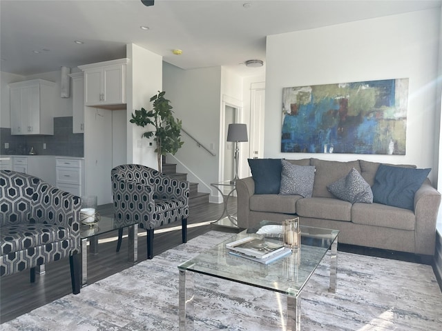 living room with dark hardwood / wood-style flooring