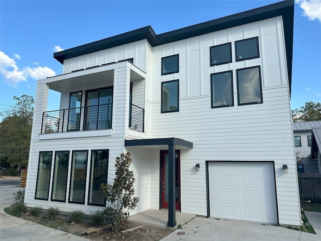 view of front of home featuring a garage and a balcony