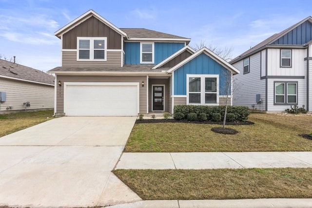 view of front of home with a garage and a front lawn