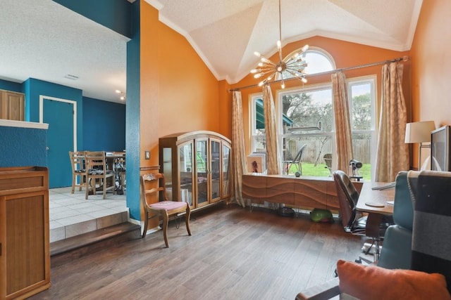 interior space featuring lofted ceiling, crown molding, hardwood / wood-style floors, a textured ceiling, and a chandelier