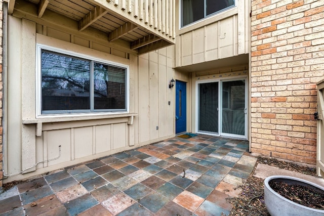 entrance to property with a patio area