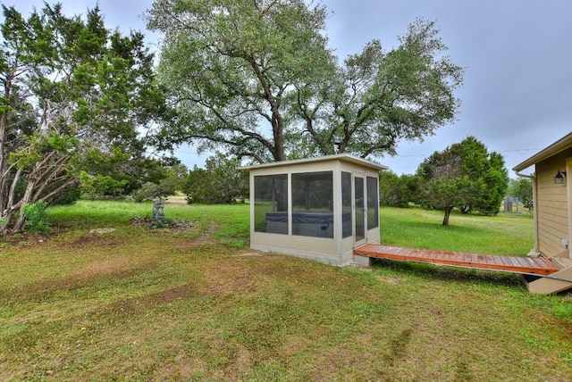 view of yard featuring a sunroom