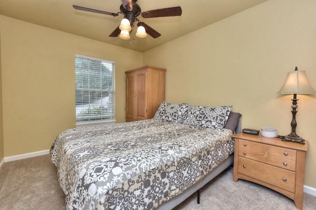 bedroom featuring light colored carpet and ceiling fan