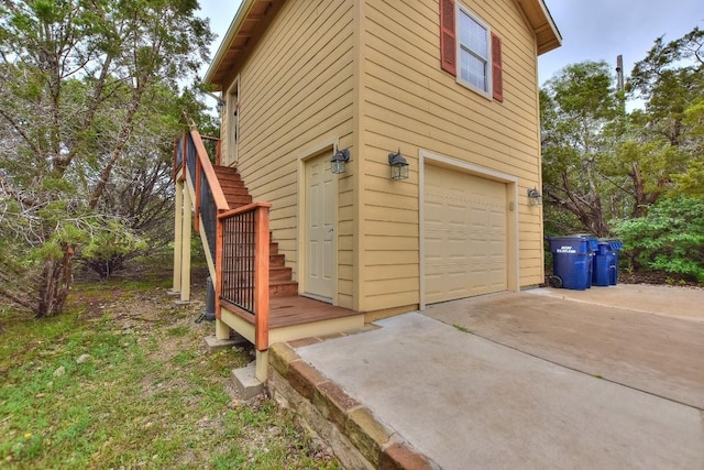 view of side of home with a garage