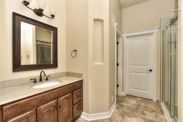 bathroom featuring vanity and a shower with shower door