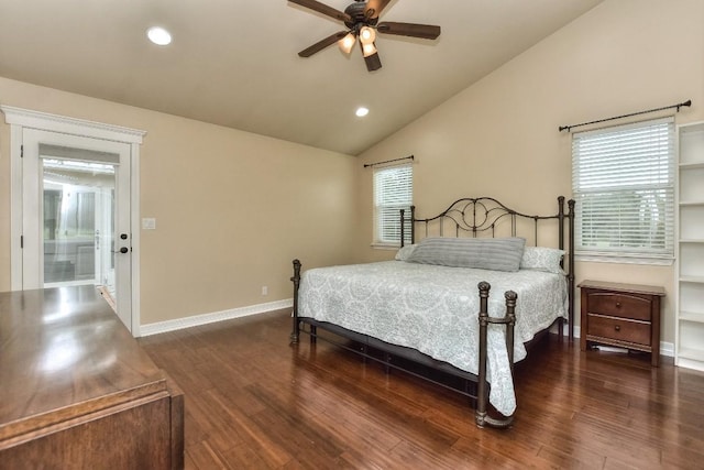 bedroom with vaulted ceiling, dark hardwood / wood-style floors, and ceiling fan