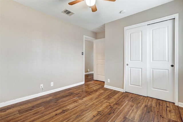 218 Cloud Rd, Hutto, TX 78634 - unfurnished bedroom with baseboards, wood finished floors, a closet, and a ceiling fan