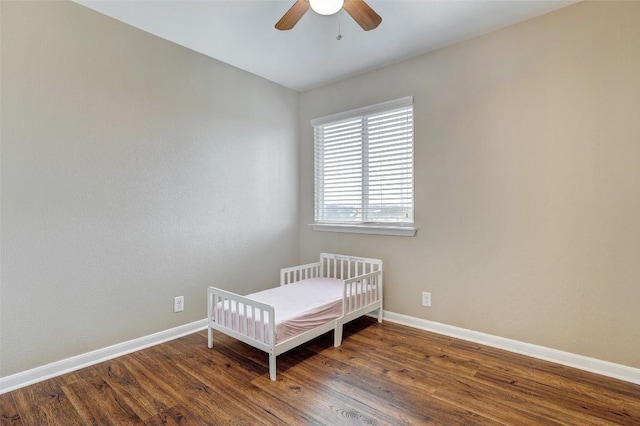 218 Cloud Rd, Hutto, TX 78634 - bedroom with wood finished floors, baseboards, and a ceiling fan