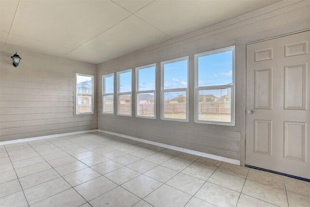218 Cloud Rd, Hutto, TX 78634 - unfurnished sunroom with tile patterned flooring and baseboards