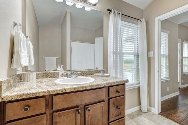 218 Cloud Rd, Hutto, TX 78634 - full bath with vanity, healthy amount of natural light, and baseboards