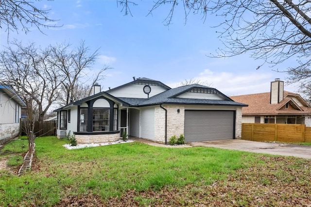 single story home with a chimney, concrete driveway, a garage, stone siding, and a front lawn