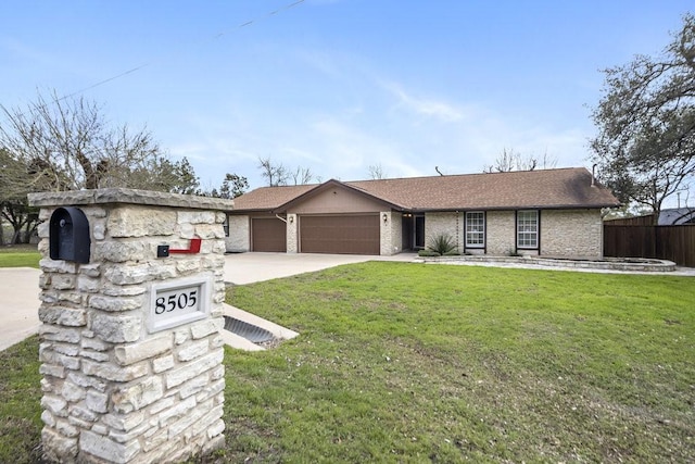 view of front facade with a garage and a front yard