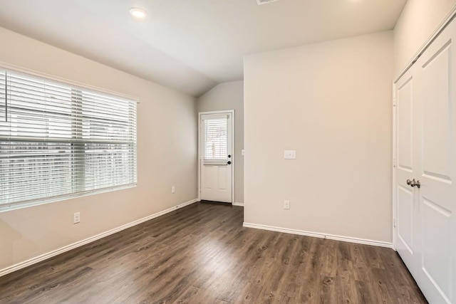 10801 Dimitrios Dr, Austin, TX 78747 - unfurnished room with lofted ceiling, dark wood-style flooring, and recessed lighting
