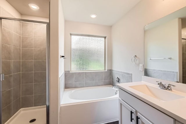 10801 Dimitrios Dr, Austin, TX 78747 - full bath with a garden tub, a stall shower, vanity, and recessed lighting