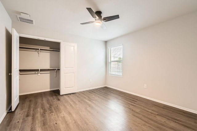 10801 Dimitrios Dr, Austin, TX 78747 - unfurnished bedroom with wood finished floors, a closet, and a ceiling fan