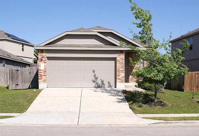 10801 Dimitrios Dr, Austin, TX 78747 - view of front of house with brick siding, concrete driveway, and a garage