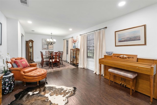 living area with recessed lighting, visible vents, an inviting chandelier, and wood finished floors