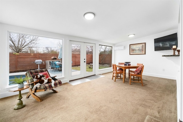 sunroom / solarium with french doors and a wall unit AC