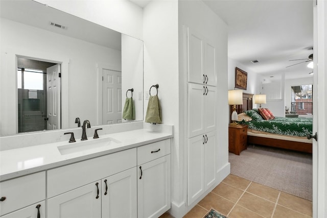 ensuite bathroom featuring visible vents, a healthy amount of sunlight, ensuite bath, and tile patterned flooring