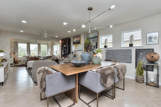 tiled dining space with ceiling fan