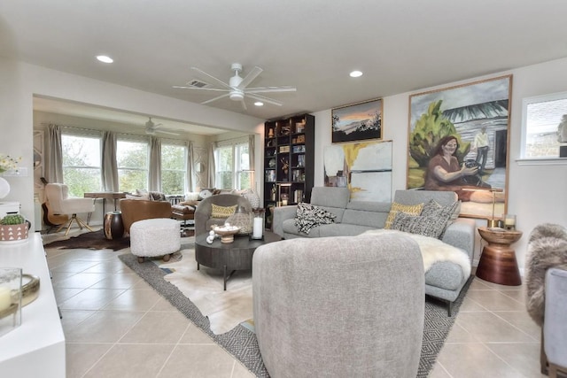 tiled living room featuring ceiling fan