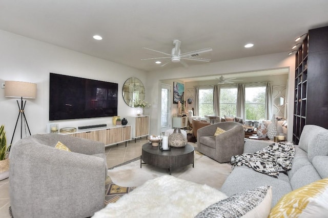 living room with ceiling fan and light tile patterned floors