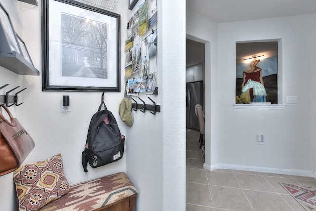 mudroom featuring light tile patterned flooring