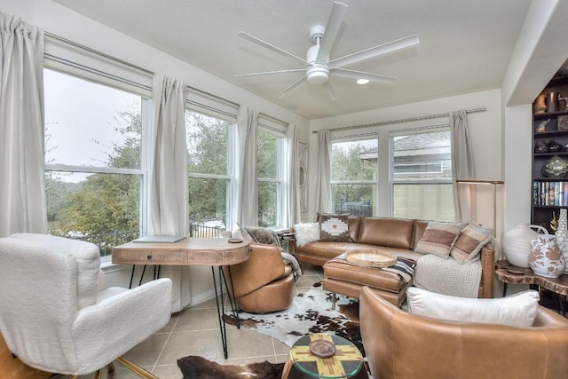 sunroom featuring ceiling fan