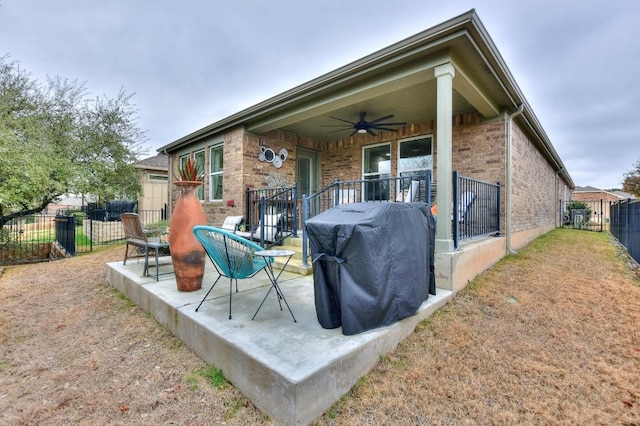 view of patio featuring a grill and ceiling fan