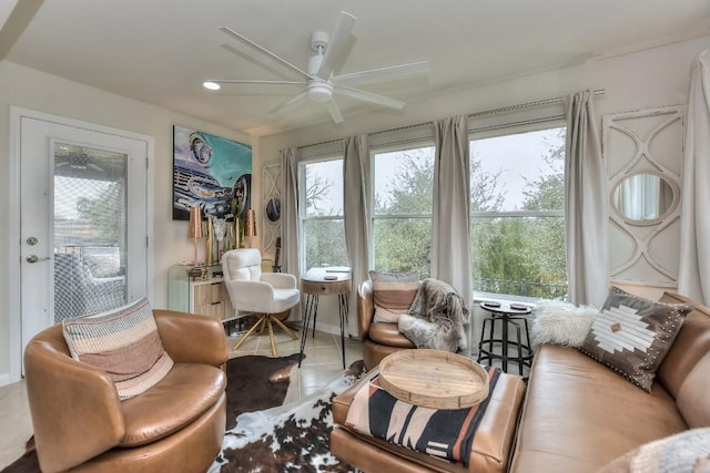 sunroom featuring ceiling fan